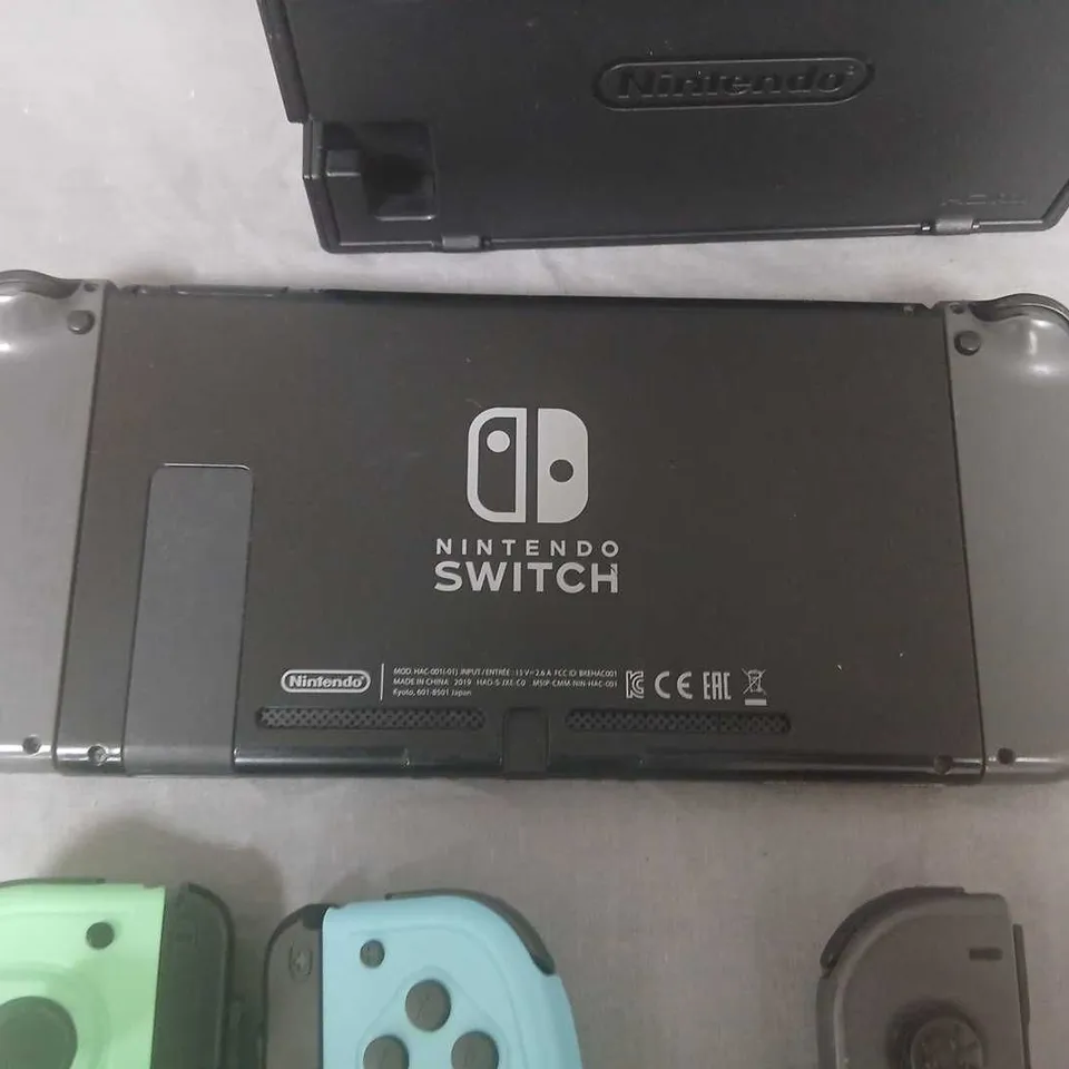 NINTENDO SWITCH CONSOLE WITH DOCK AND FOUR JOY-CON CONTROLLERS (NEON GREEN, NEON BLUE, GREY & PINK)
