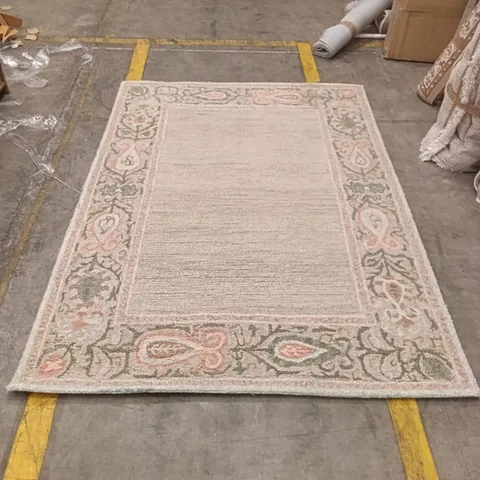 AREA RUG WITH PINK AND GREEN FLORAL BORDER AND NEUTRAL CENTRE APPROXIMATELY 227 CM X 158 CM