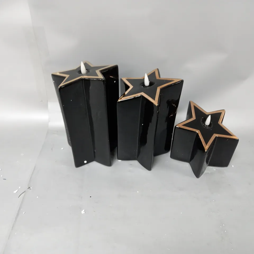 BOXED HOME REFLECTIONS PORCELAIN STAR PRE-LIT CANDLES IN BLACK 