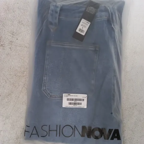 BAGGED FASHION NOVA TALL DOUBLING DOWN RIPPED FLARE JEANS IN BLUE SIZE 9