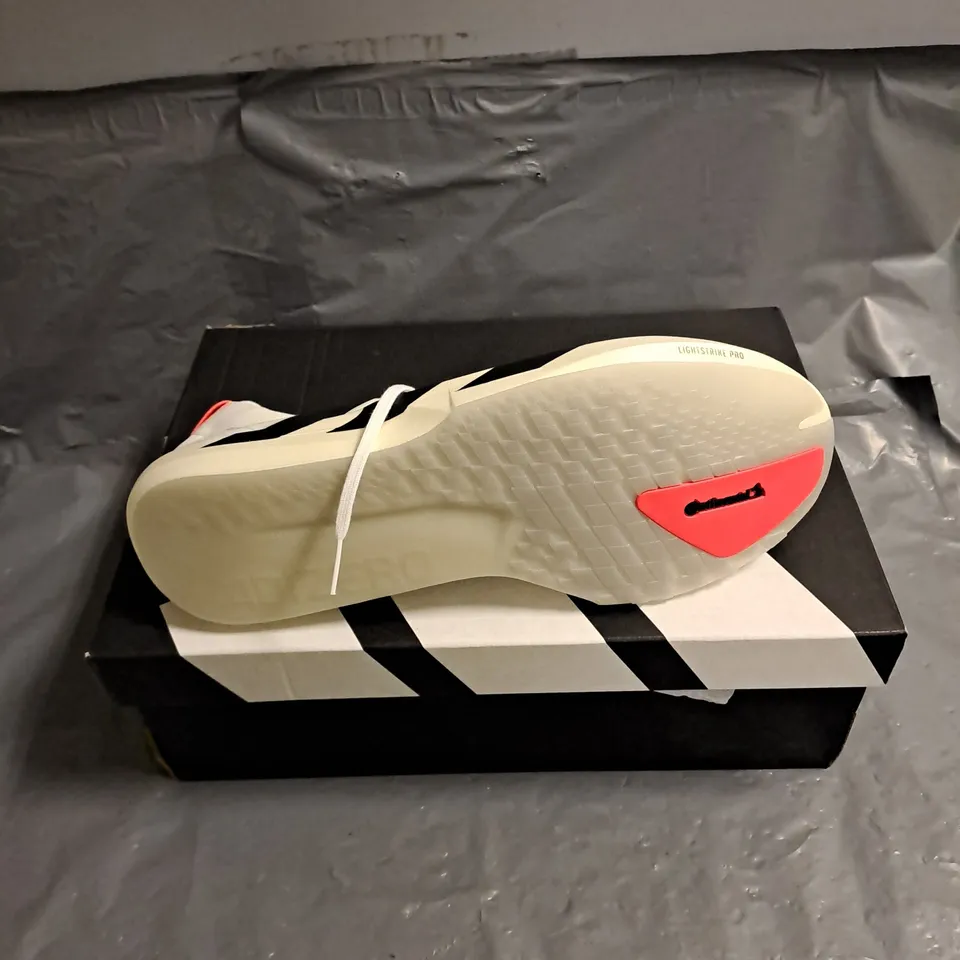 BOXED PAIR OF ADIDAS ADIZERO ADIOS 9 RUNNING SHOES IN WHITE/BLACK SIZE UK 9.5