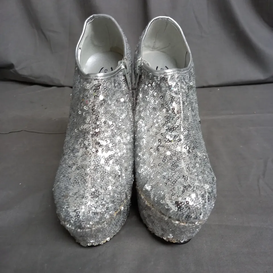 APPROXIMATELY 14 PAIRS OF WOMENS ZIPPED SEQUIN HIGH HEEL SHOES IN VARIOUS SIZES