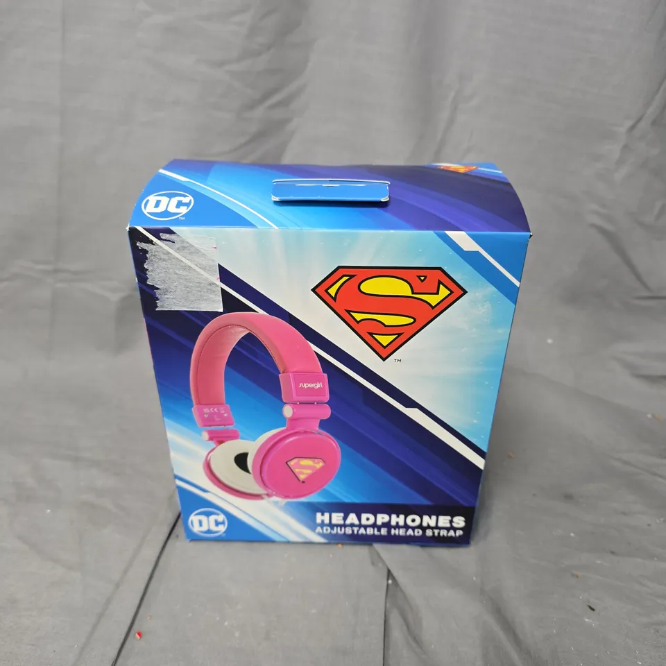 BOXED AND SEALED DC SUPERGIRL HEADPHONES ADJUSTABLE HEAD STRAP IN PINK