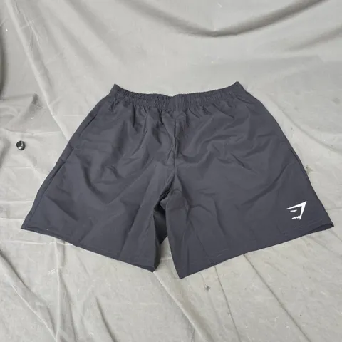 GYMSHARK ARRIVAL 7" SHORTS IN BLACK SIZE M