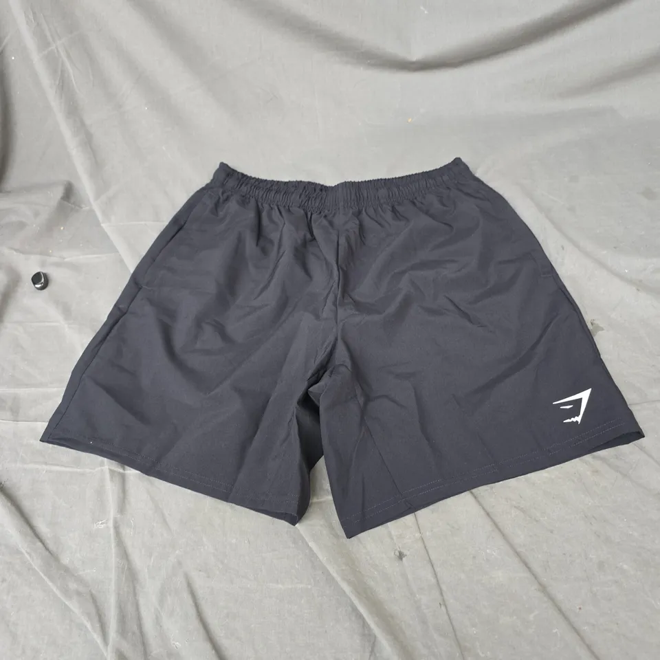 GYMSHARK ARRIVAL 7" SHORTS IN BLACK SIZE M