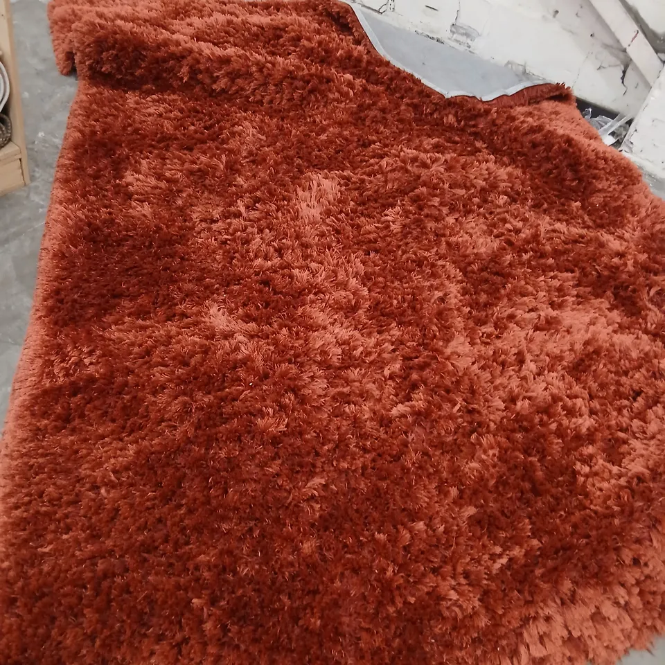 LARGE RED SHAGGY RUG