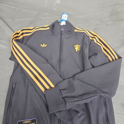 ADIDAS MANCHESTER UNITED OFFICIAL TRACK JACKET – BLACK WITH YELLOW STRIPES, UK SIZE S