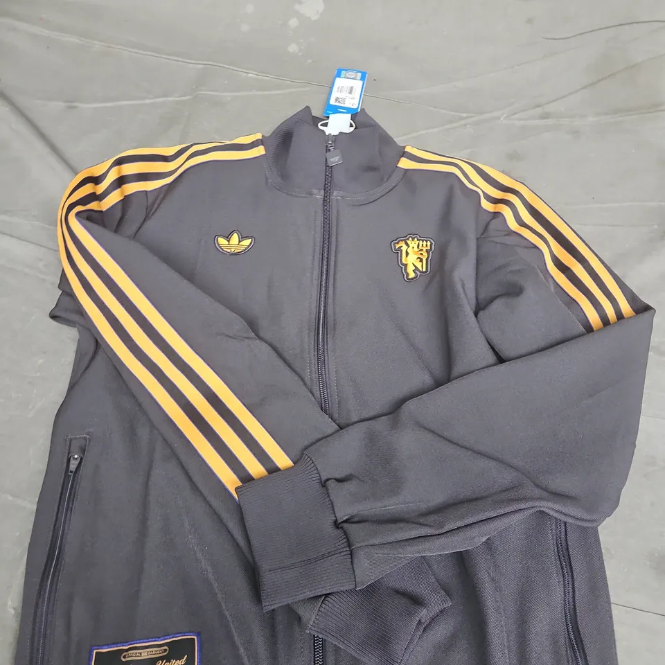 ADIDAS MANCHESTER UNITED OFFICIAL TRACK JACKET – BLACK WITH YELLOW STRIPES, UK SIZE S