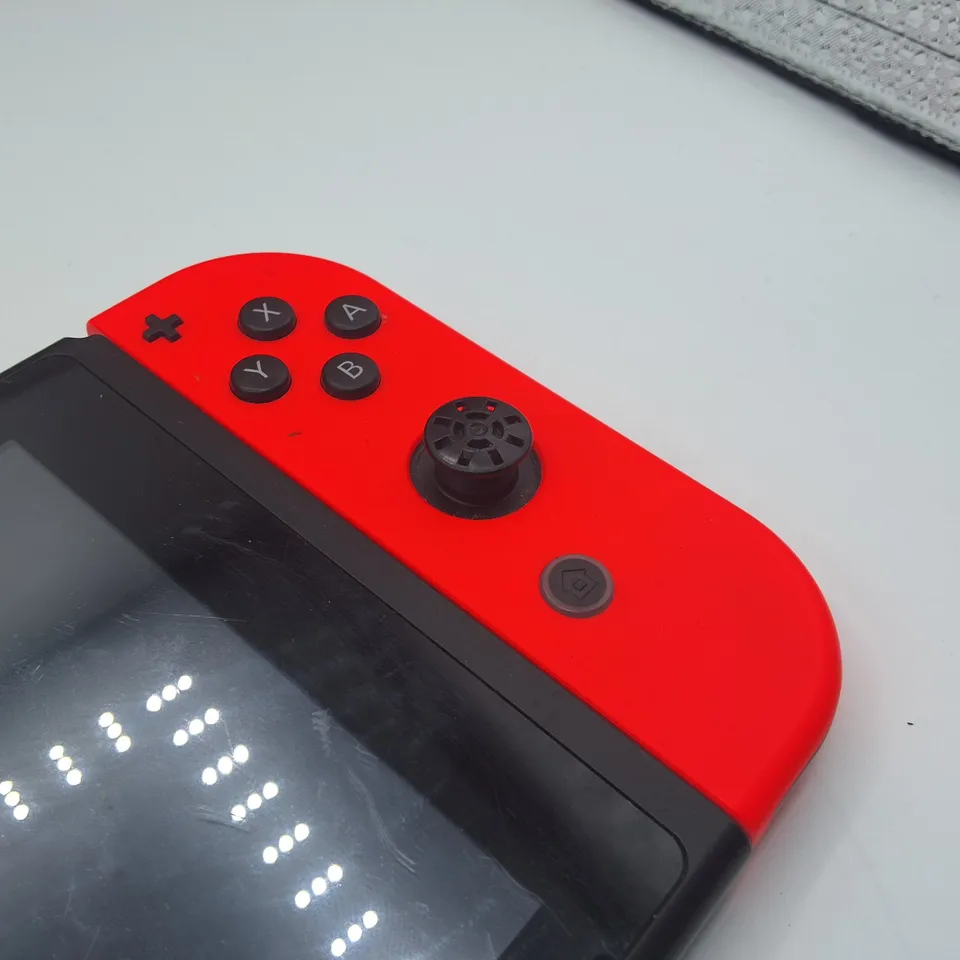 NINTENDO SWITCH HANDHELD CONSOLE WITH NINTENDO BRANDED MESSENGER CARRY BAG AND ACCESSORIES 