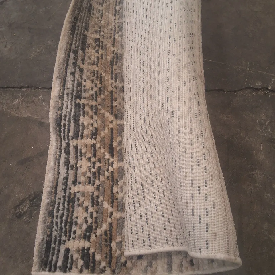 ROLLED PATTERN OVER WHITE RUG - APPROXIMATELY 230CM X UNSPECIFIED 