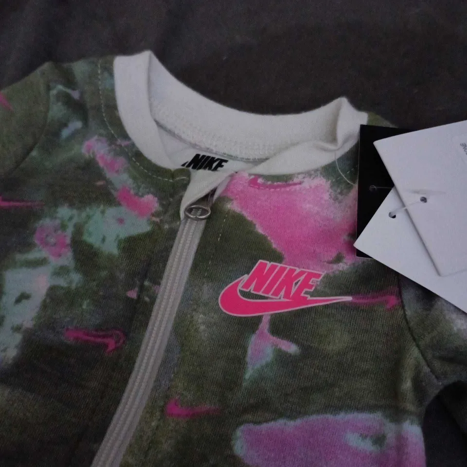 NIKE BABY ROMPER NEWBORN 0–3 MONTHS – CAMOUFLAGE WITH PINK ACCENTS