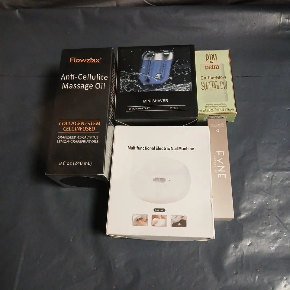 APPROXIMATELY 20 ASSORTED COSMETIC ITEMS TO INCLUDE MINI SHAVER. ANTI CELLULITE OIL, PIXI BY PETRA SUPERGLOW, ELECTRIC NAIL MACHINE, FYNE CONCEALER ETC