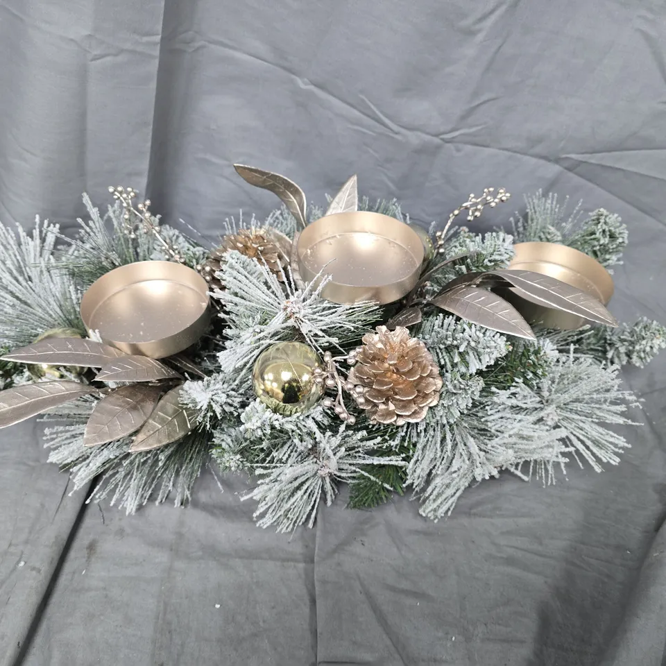 FESTIVE FROSTED GARLAND WITH PINE CONES AND GOLD CANDLE HOLDERS