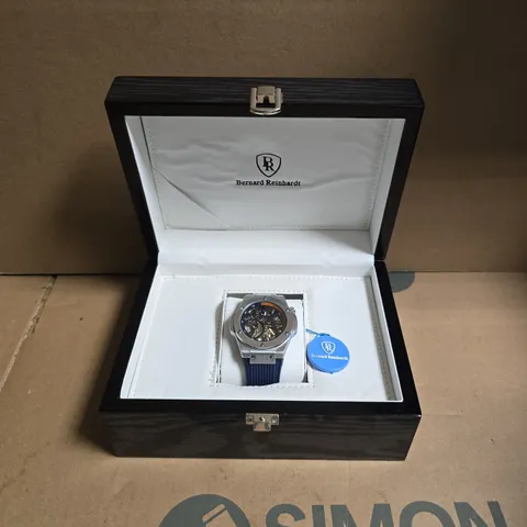MENS BERNARD REINHARDT MECHANICAL SKELETON WATCH WITH BLUE RUBBER STRAP