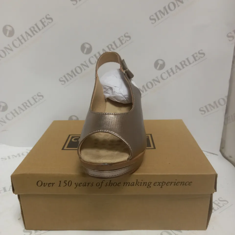 BOXED PAIR OF CUSHION WALK WEDGE HEEL SHOES IN GOLD - SIZE 5