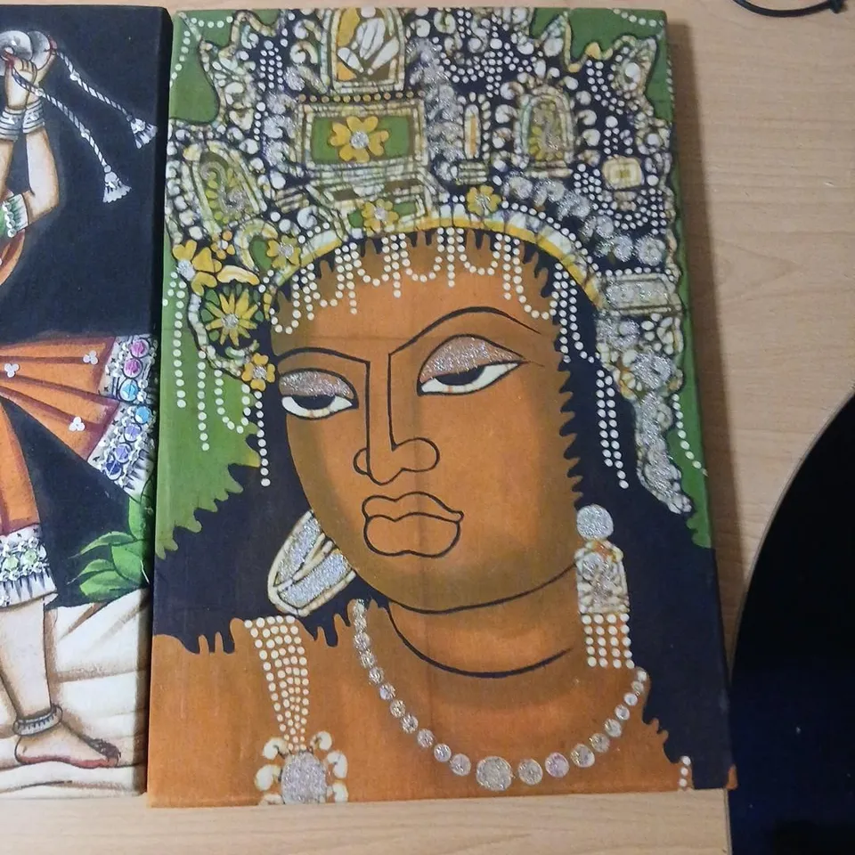 TWO  HANDMADE RAJASTHANI FABRIC STYLE WALL HANGINGS ONE DEPICTING A TRADITIONAL DANCER AND ONE DEPICTING A KERALA LADY