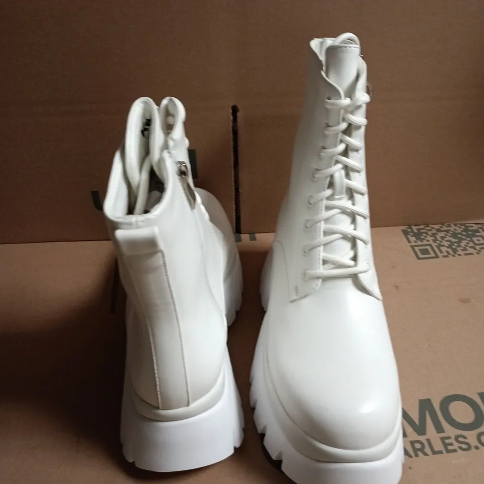 BOXED KOI RANCOR LACE UP MONSTER PLATFORM BOOTS IN WHITE, UK6