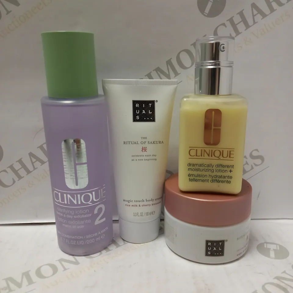 LOT OF 4 ASSORTED BEAUTY PRODUCTS TO INCLUDE CLINIQUE MOISTURIZING LOTION, THE RITUAL OF SAKURA BODY CREAM, CLINIQUE CLARIFYING LOTION, ETC 