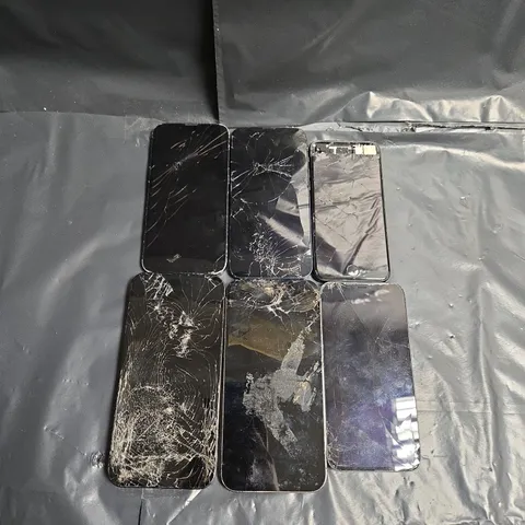 6 ASSORTED SIGNIFICANTLY DAMAGED IPHONES IN VARIOUS STYLES & MODELS