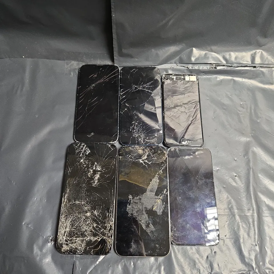 6 ASSORTED SIGNIFICANTLY DAMAGED IPHONES IN VARIOUS STYLES & MODELS