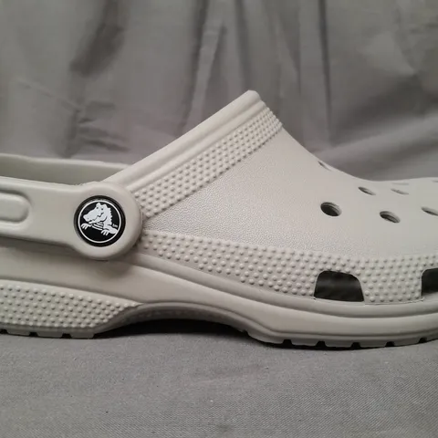 PAIR OF CROCS CLASSICS IN GREY UK SIZE M3/W4