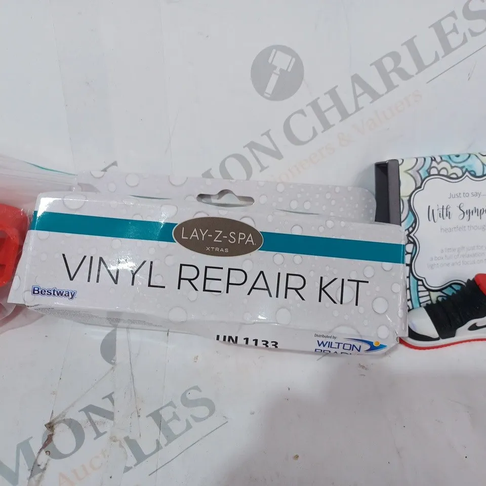 APPROXIMATELY 10 ASSORTED HOUSEHOLD ITEMS TO INCLUDE AIR JORDAN KEYRING, LAY-Z-SPA VINYL REPAIR KIT, ETC