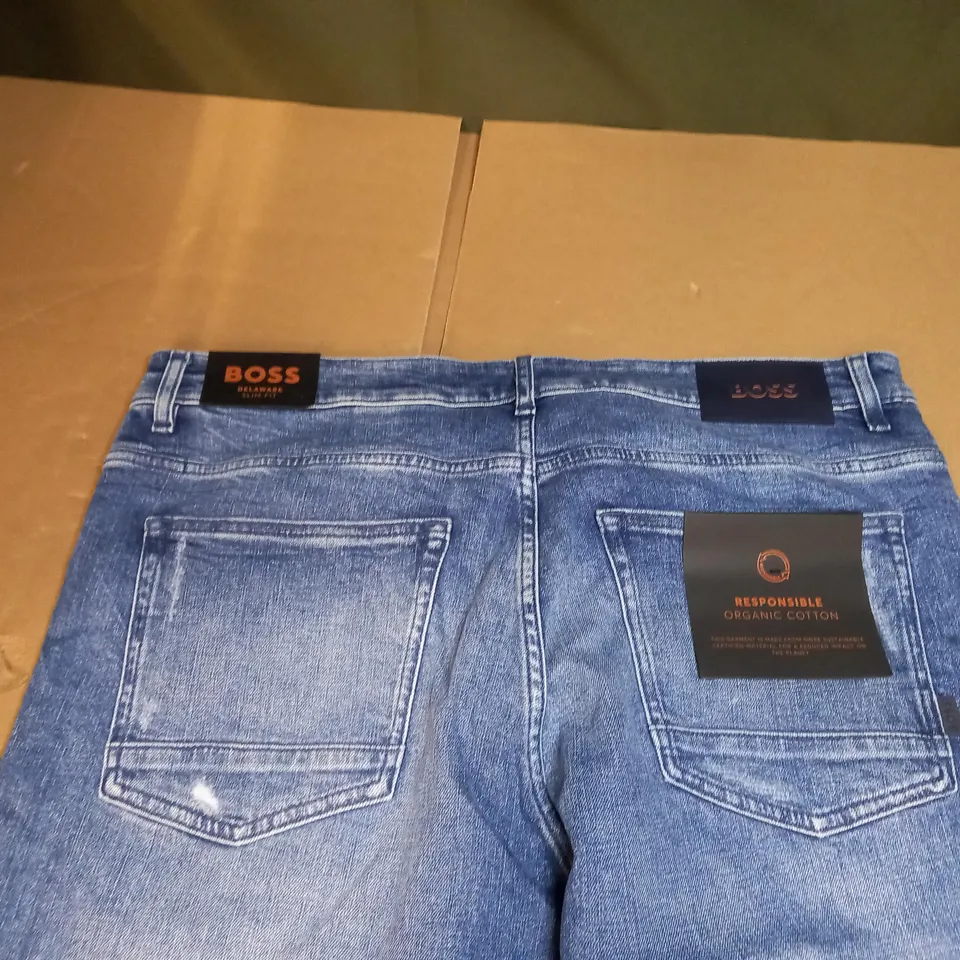 PAIR OF HUGO BOSS PALE BLUE DENIM JEANS SIZE UNSCPECIFIED