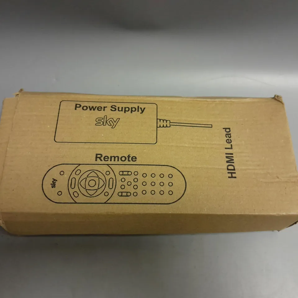 BOXED SKY TV REMOTE AND POWER SUPPLY