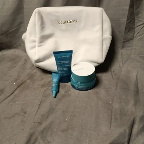 CLARINS SKIN CARE KIT IN WHITE POUCH INCLUDING HYDRA-ESSENTIAL CREME, HYDRA-ESSENTIAL SQUALANE, TOTAL EYE CONTOUR GEL