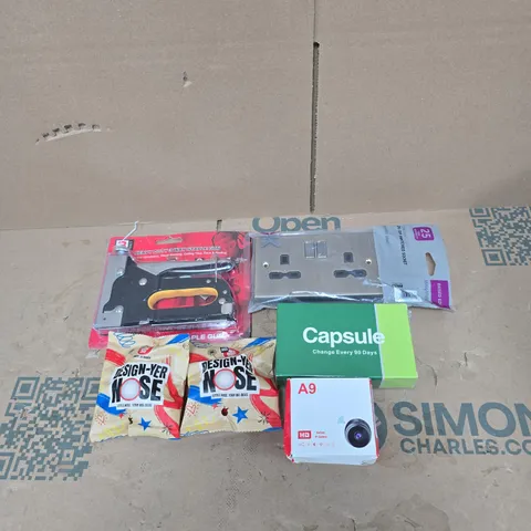 TOTE OF APPROXIMATELY 20 ASSORTED HOUSEHOLD ITEMS TO INCLUDE RED NOSE DAY "DESIGN YOUR NOSE", STAPLE GUN, CAPSULE FILTER, HD BATTERY IP CAMERA, SWITCHED SOCKET ETC