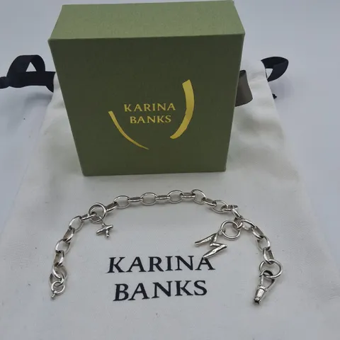 BOXED KARINA BANKS SILVER TONE BRACELET WITH CHARMS