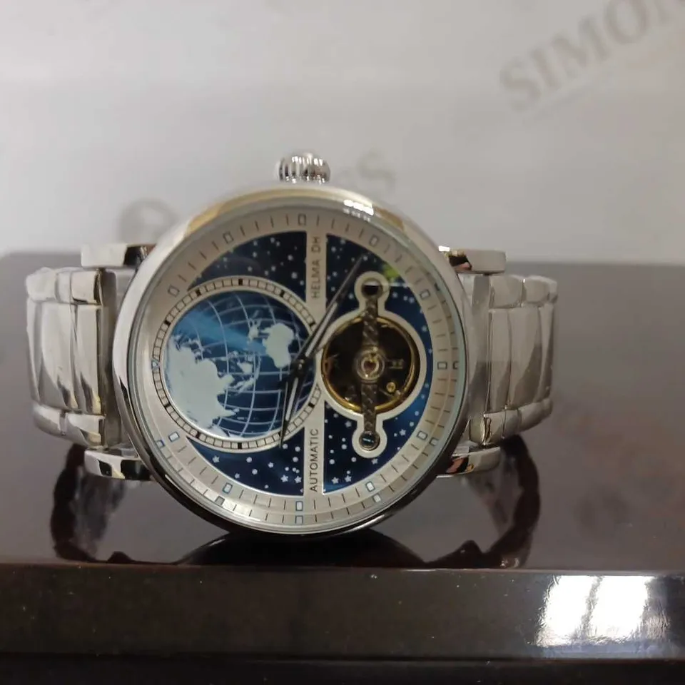 MEN’S HELMA DH AUTOMATIC WORLD VIEW WATCH – TOURBILLON MOVEMENT – BLUE DIAL – STAINLESS STEEL STRAP – GLASS EXHIBITION BACK CASE – LEATHER STRAP INCLUDED 