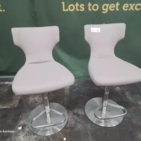 PAIR OF DESIGNER UPHOLSTERED BAR STOOLS FAWN FAUX LEATHER ON BRUSHED STEEL SUPPORT