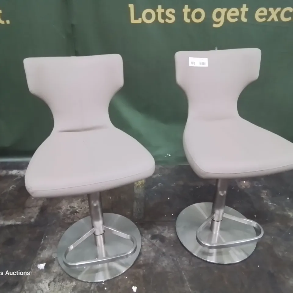 PAIR OF DESIGNER UPHOLSTERED BAR STOOLS FAWN FAUX LEATHER ON BRUSHED STEEL SUPPORT