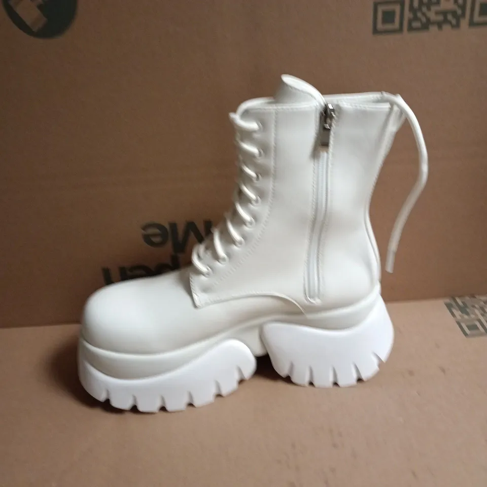 BOXED KOI RANCOR LACE UP MONSTER PLATFORM BOOTS IN WHITE, UK6