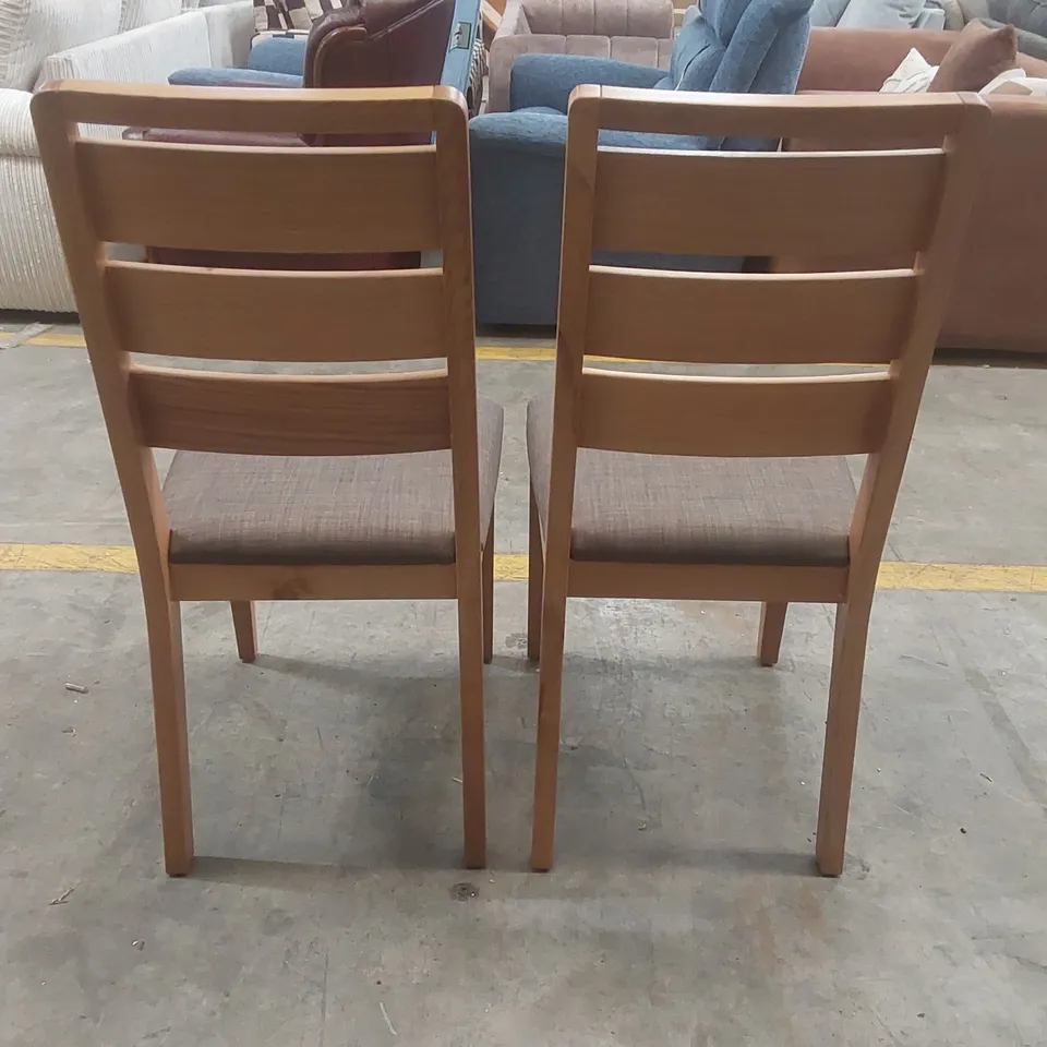PAIR OF DESIGNER WOODEN DINING CHAIRS WITH PADDED UPHOLSTERED SEATS
