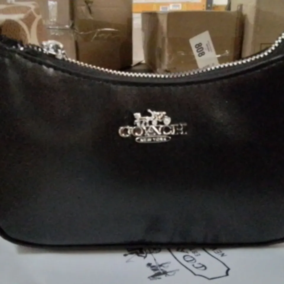 BOXED BLACK LEATHER COACH CLUTCH BAG