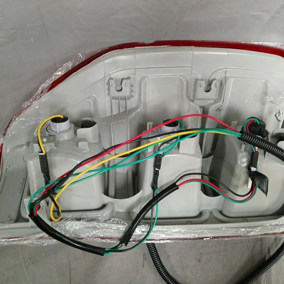 AUTOMOTIVE REAR TAIL LIGHT ASSEMBLY WITH WIRING HARNESS