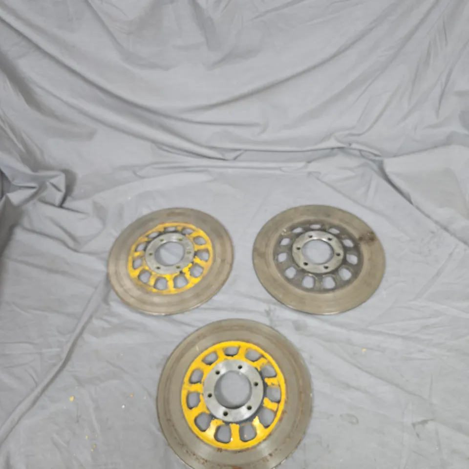 3 UNIDENTIFIED ASSORTED DRILLED BRAKE DISC ROTORS