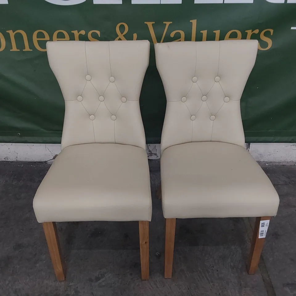 PAIR OF UPHOLSTERED BUTTONED BACK DINING CHAIRS CREAM PU ON NATURAL WOOD LEGS 
