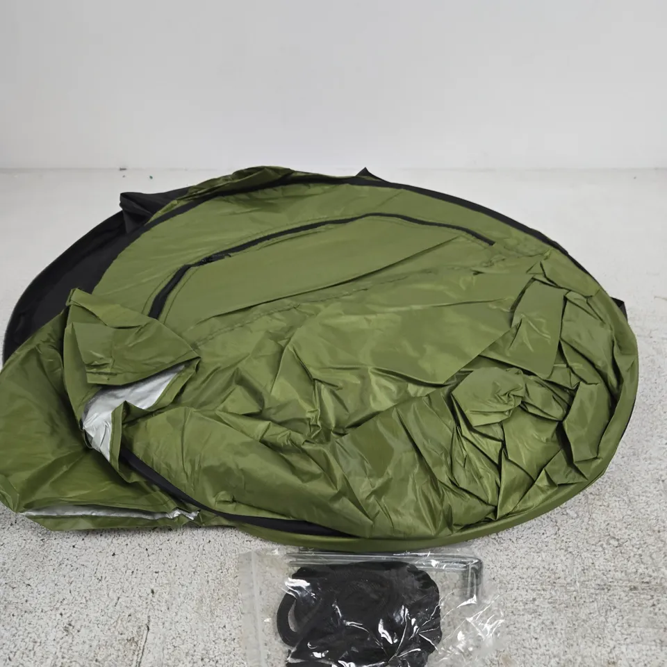 FOLDED-UP GREEN PORTABLE POP-UP PRIVACY TENT