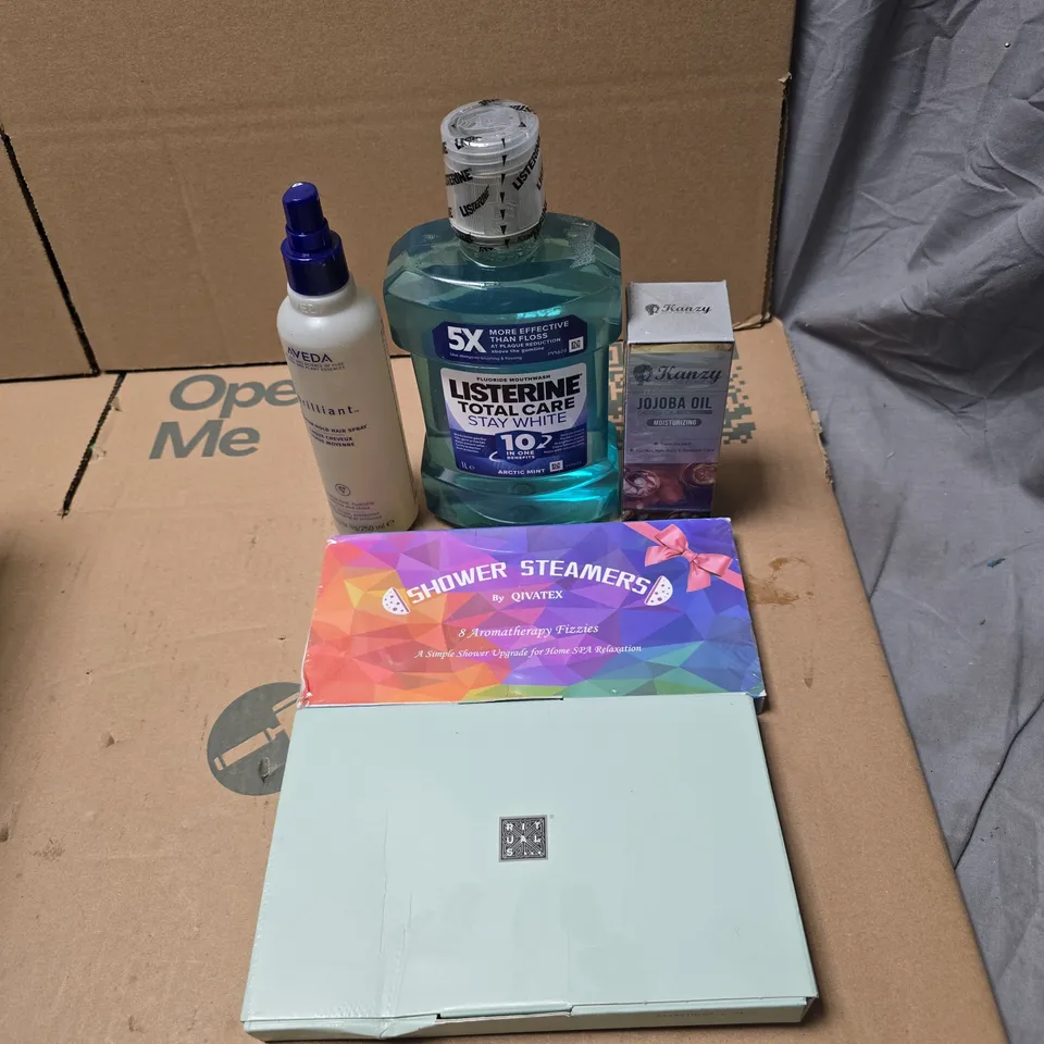 TOTE OF APPROXIMATELY 15 ASSORTED COSMETIC ITEMS TO INCLUDE LISTERINE, JOJOBA OIL, AVEDA HAIR SPRAY, RITUALS...MINI GIFT SET ETC