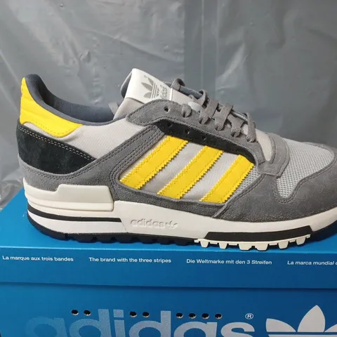BOXED PAIR OF ADIDAS ZX 600 TRAINERS IN GREY/YELLOW - UK 9