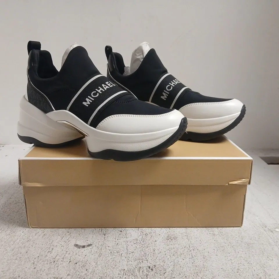 BOXED PAIR OF MICHAEL KORS OLYMPIA SLIP-ON SHOES IN BLACK/WHITE SIZE US 10M