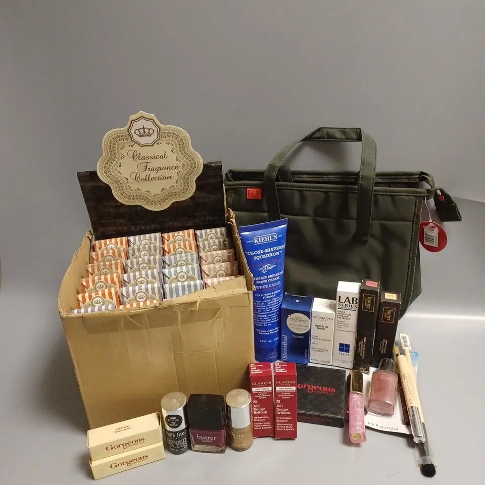 APPROXIMATELY 20 ASSORTED BEAUTY PRODUCTS TO INCLUDE CLASSICAL FRAGRANCE COLLECTION, CLARINS EXTRA-FIRMING FOUNDATION, BUTTER MASCARA, CLARINS LIPSTICK, BUTTER NAIL LACQUER, COSMETICS BAG