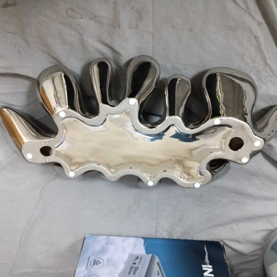 Chrome-plated decorative serving dish with lobed edges