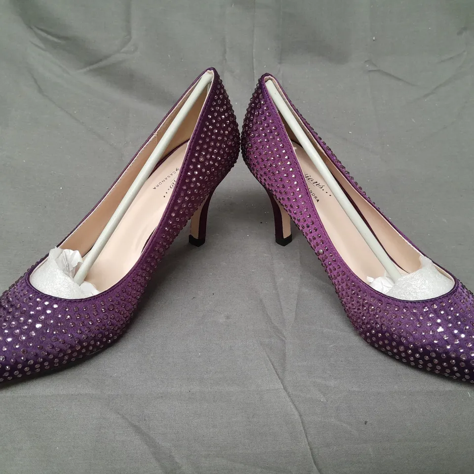BOX OF APPROXIMATELY 10 BOXED PAIRS OF CASANDRA CLOSED TOE HEELED SHOES IN PURPLE W. JEWEL EFFECT - VARIOUS SIZES
