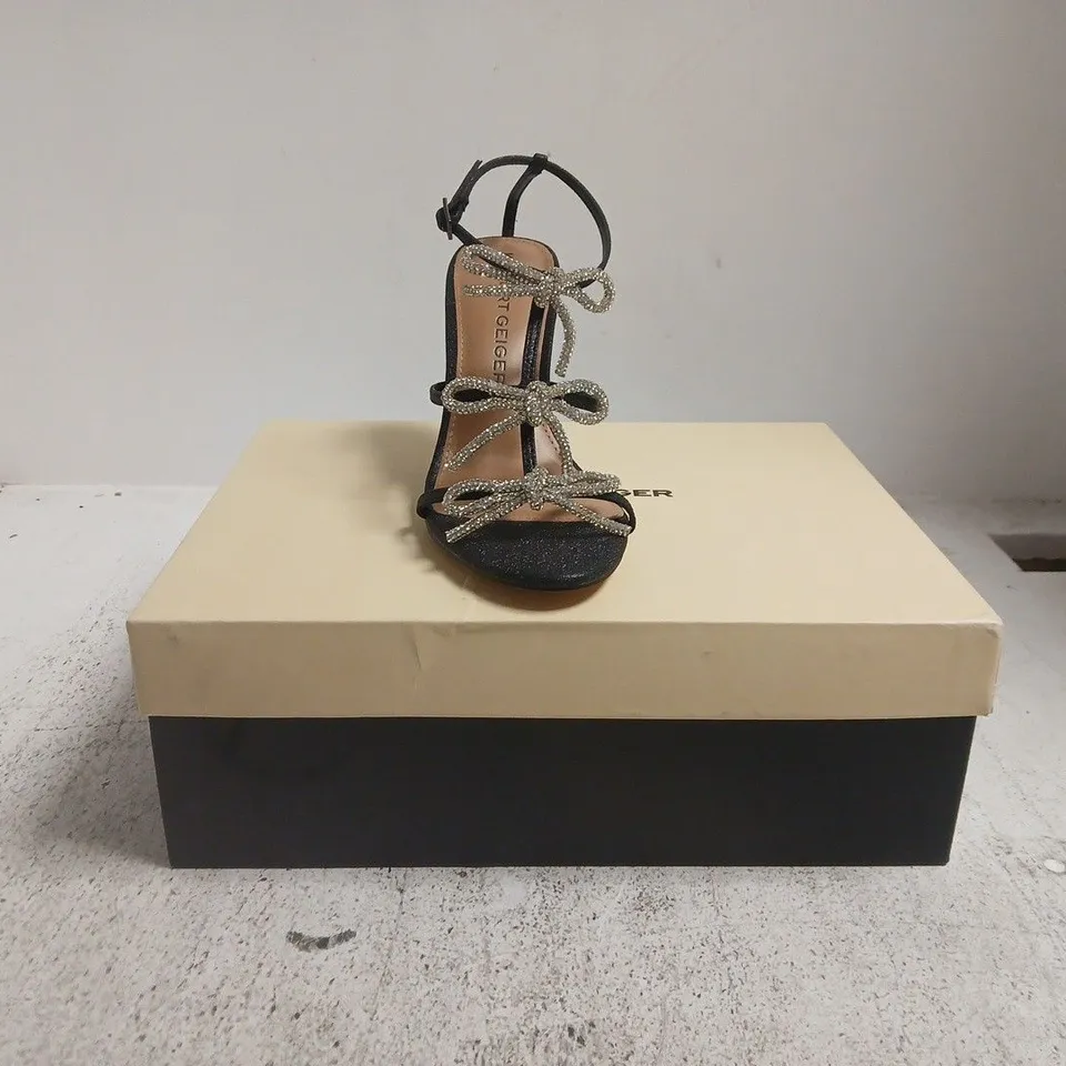 BOXED PAIR OF KURT GEIGER OPEN TOE HEELS IN BLACK GLITTER W. JEWEL EFFECT BOW DETAIL SIZE EU 37