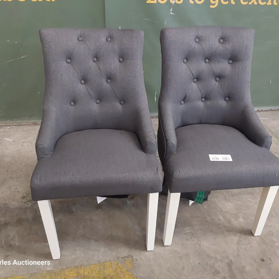PAIR OF UPHOLSTERED BUTTONED BACK DINING CHAIRS CHARCOAL FABRIC ON WHITE PAINTED LEGS 