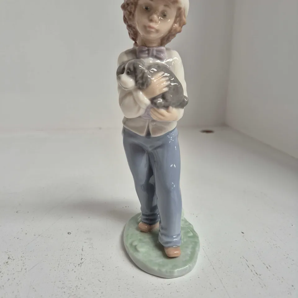 NAO LLADRÓ PORCELAIN FIGURINE – BOY HOLDING A DOG